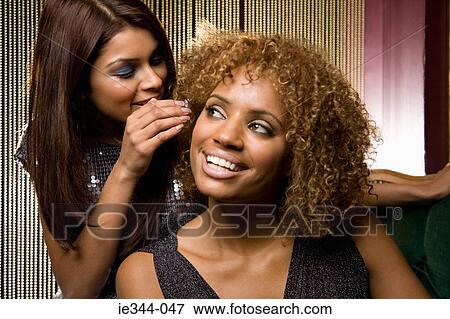 Stock Photo - Friends gossiping. Fotosearch
