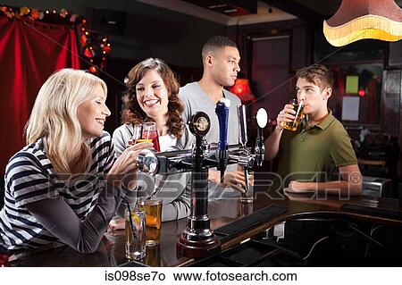 Picture - Friends in bar. Fotosearch