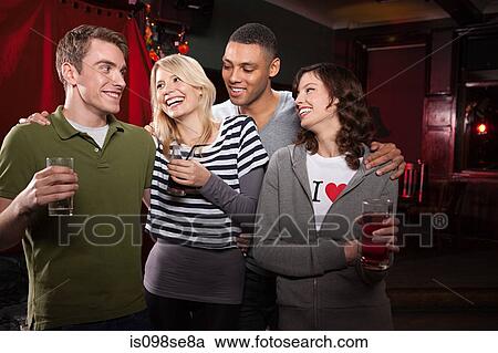 Stock Image - Friends in bar. Fotosearch