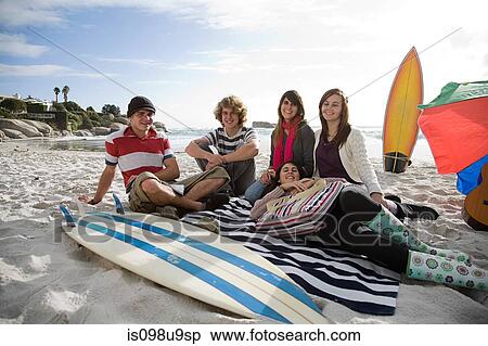 Friends on beach with surfboard View Large Photo Image Stock Photography - Friends on beach with surfboard. Fotosearch