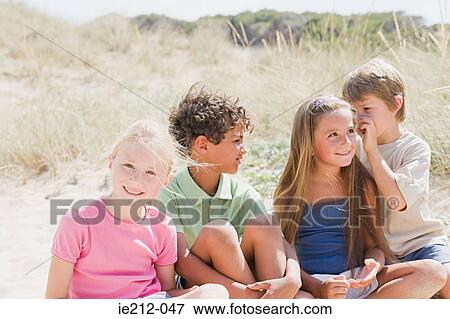 Stock Photo - Friends on the beach. Fotosearch