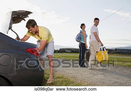 Friends preparing for a picnic View Large Photo Image Stock Photography - Friends preparing for a picnic. Fotosearch