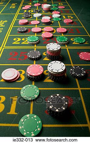 Stock Image - Gambling chips on a roulette table. Fotosearch