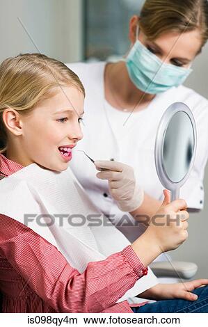 Girl and dental hygienist View Large Photo Image Picture - Girl and dental hygienist. Fotosearch