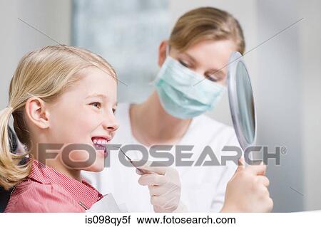 Girl and dental hygienist View Large Photo Image Stock Image - Girl and dental hygienist. Fotosearch