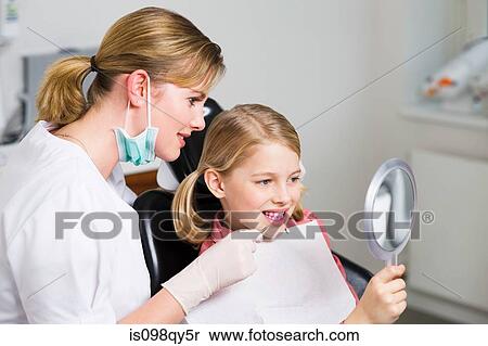 Girl and dentist View Large Photo Image Stock Photography - Girl and dentist. Fotosearch