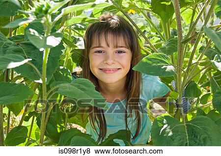 Girl and plants View Large Photo Image Stock Photo - Girl and plants. Fotosearch