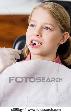 Stock Image - Girl at dentists office. Fotosearch