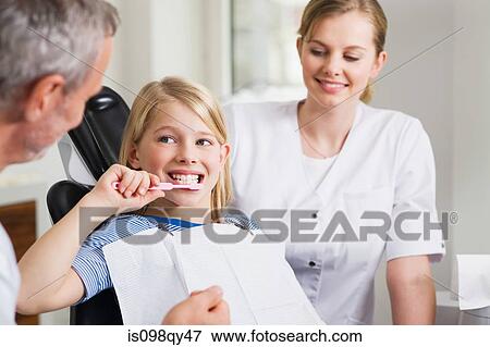 Girl at dentists office View Large Photo Image Stock Photo - Girl at dentists office. Fotosearch