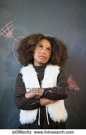 Girl by blackboard View Large Photo Image Stock Photo - Girl by blackboard. Fotosearch