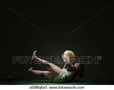 Girl catching beach ball View Large Photo Image Stock Image - Girl catching beach ball. Fotosearch