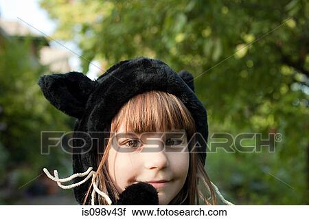Stock Image - Girl dressed as cat. Fotosearch