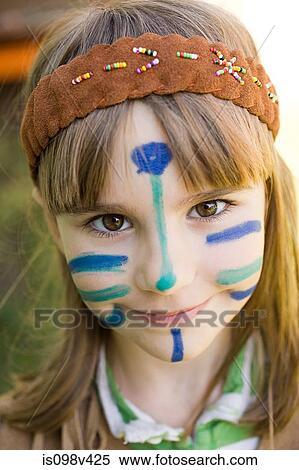 Stock Photography - Girl dressed in Native American costume with face painted. Fotosearch