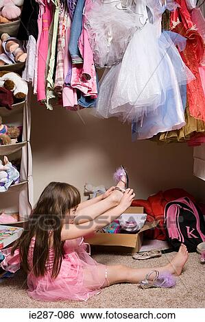 Girl dressing up View Large Photo Image Stock Photograph - Girl dressing up. Fotosearch