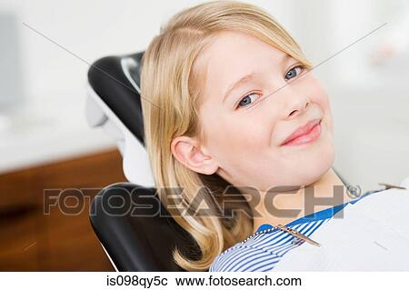 Stock Image - Girl in dentists chair. Fotosearch