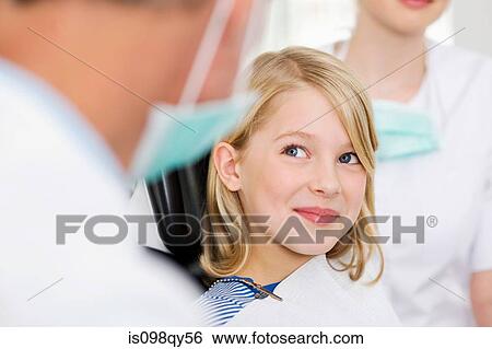 Girl in dentists office View Large Photo Image Stock Photograph - Girl in dentists office. Fotosearch
