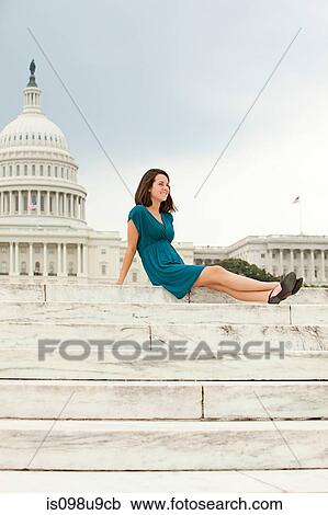 Stock Image - Girl on steps by united states capitol building. Fotosearch