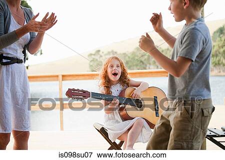Girl playing guitar View Large Photo Image Stock Photo - Girl playing guitar. Fotosearch