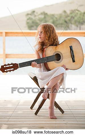 Girl playing guitar View Large Photo Image Stock Photo - Girl playing guitar. Fotosearch