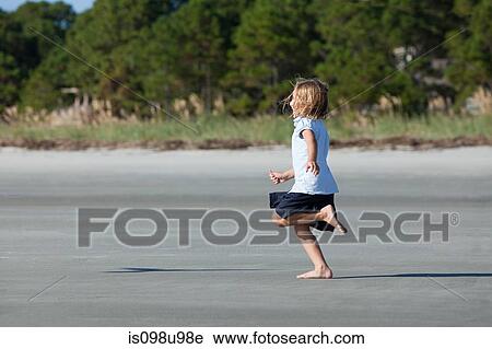 Girl running on beach View Large Photo Image Stock Image - Girl running on beach. Fotosearch