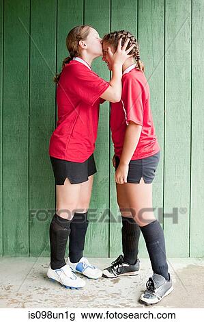 Girl soccer player kissing teammate View Large Photo Image Stock Image - Girl soccer player kissing teammate. Fotosearch