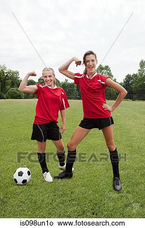 Girl soccer players flexing muscles View Large Photo Image Picture - Girl soccer players flexing muscles. Fotosearch