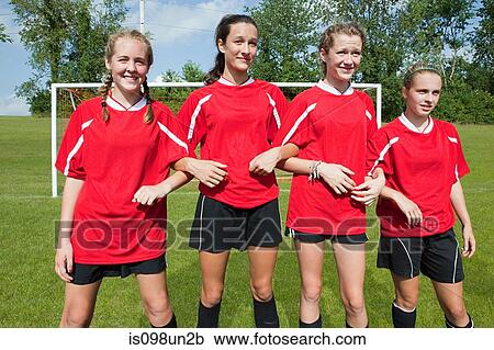 Stock Image - Girl soccer players make defensive wall. Fotosearch
