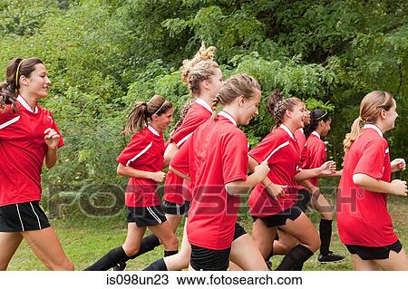 Girl soccer players running View Large Photo Image Stock Image - Girl soccer players running. Fotosearch