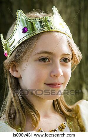 Girl wearing crown dressed up as queen View Large Photo Image Stock Image - Girl wearing crown dressed up as queen. Fotosearch