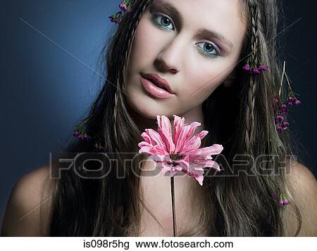 Stock Image - Girl with a flower. Fotosearch