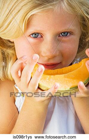 Girl with a slice of melon View Large Photo Image Stock Photograph - Girl with a slice of melon. Fotosearch