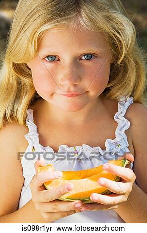 Girl with a slice of melon View Large Photo Image Stock Photography - Girl with a slice of melon. Fotosearch