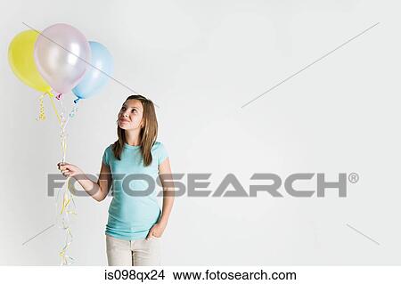 Girl with balloons View Large Photo Image Picture - Girl with balloons. Fotosearch