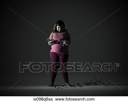 Girl with candy wrappers View Large Photo Image Stock Image - Girl with candy wrappers. Fotosearch