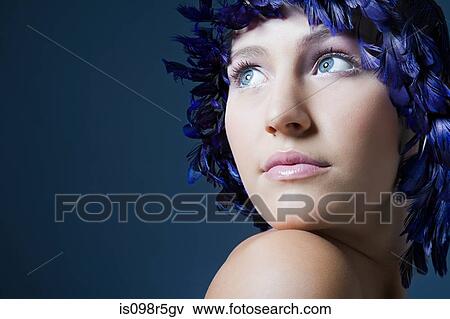 Stock Photo - Girl with feather headdress. Fotosearch