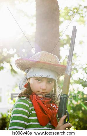 Stock Photograph - Girls dressed up as cowgirl. Fotosearch