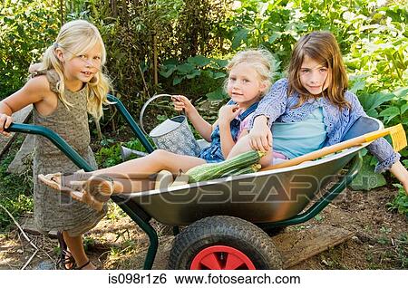 Girls in a wheelbarrow View Large Photo Image Stock Photograph - Girls in a wheelbarrow. Fotosearch