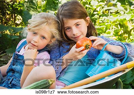 Stock Photo - Girls in garden. Fotosearch