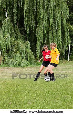Girls playing soccer View Large Photo Image Stock Photo - Girls playing soccer. Fotosearch