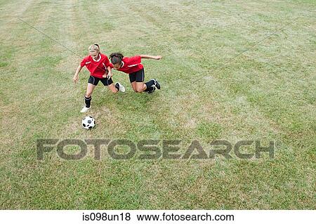 Stock Photo - Girls playing soccer. Fotosearch