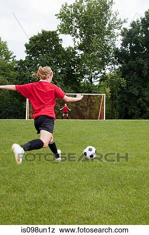 Stock Photo - Girls playing soccer. Fotosearch