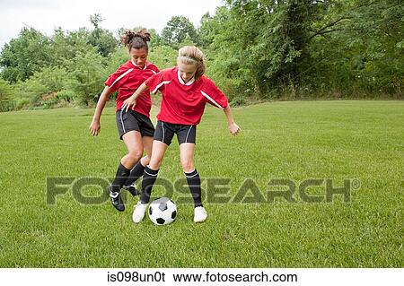 Girls playing soccer View Large Photo Image Stock Photograph - Girls playing soccer. Fotosearch