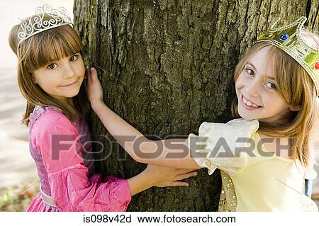 Girls wearing crown dressed up as queens View Large Photo Image Stock Image - Girls wearing crown dressed up as queens. Fotosearch