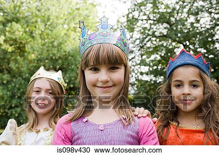 Girls wearing crown dressed up as queens View Large Photo Image Stock Image - Girls wearing crown dressed up as queens. Fotosearch