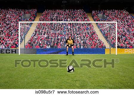 Stock Photo - Goalkeeper and football. Fotosearch