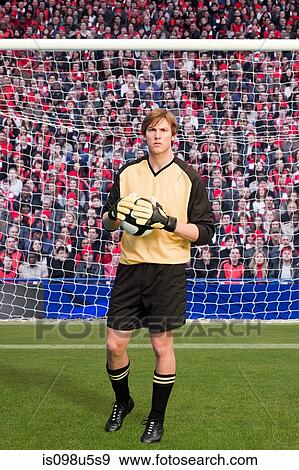 Goalkeeper holding football View Large Photo Image Stock Photo - Goalkeeper holding football. Fotosearch