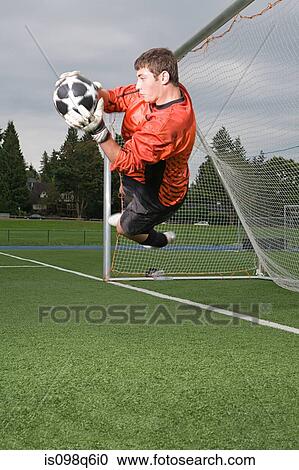 Stock Image - Goalkeeper making a save. Fotosearch