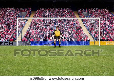 Stock Image - Goalkeeper standing in goal. Fotosearch