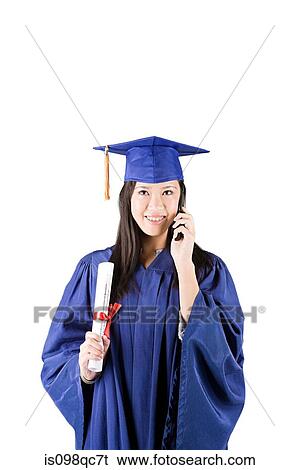Graduating girl on cellphone View Large Photo Image Stock Photograph - Graduating girl on cellphone. Fotosearch