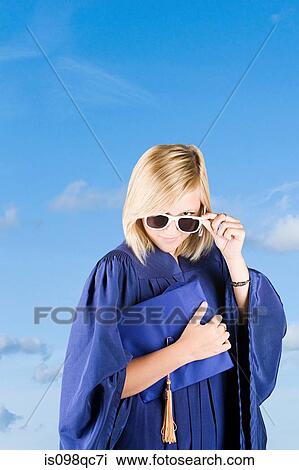 Graduating girl wearing sunglasses View Large Photo Image Stock Image - Graduating girl wearing sunglasses. Fotosearch
